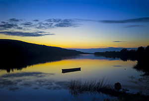 Blue and Yellow Sunset with boat, River Suir